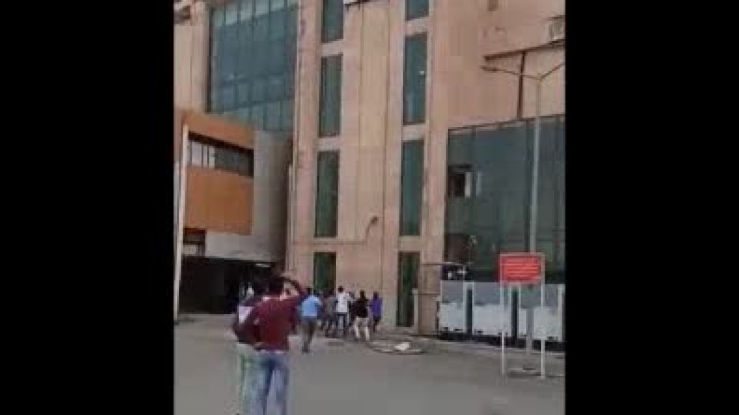 Indo-Asian Woman Jumps Off Train Station Building In India; cops just watch