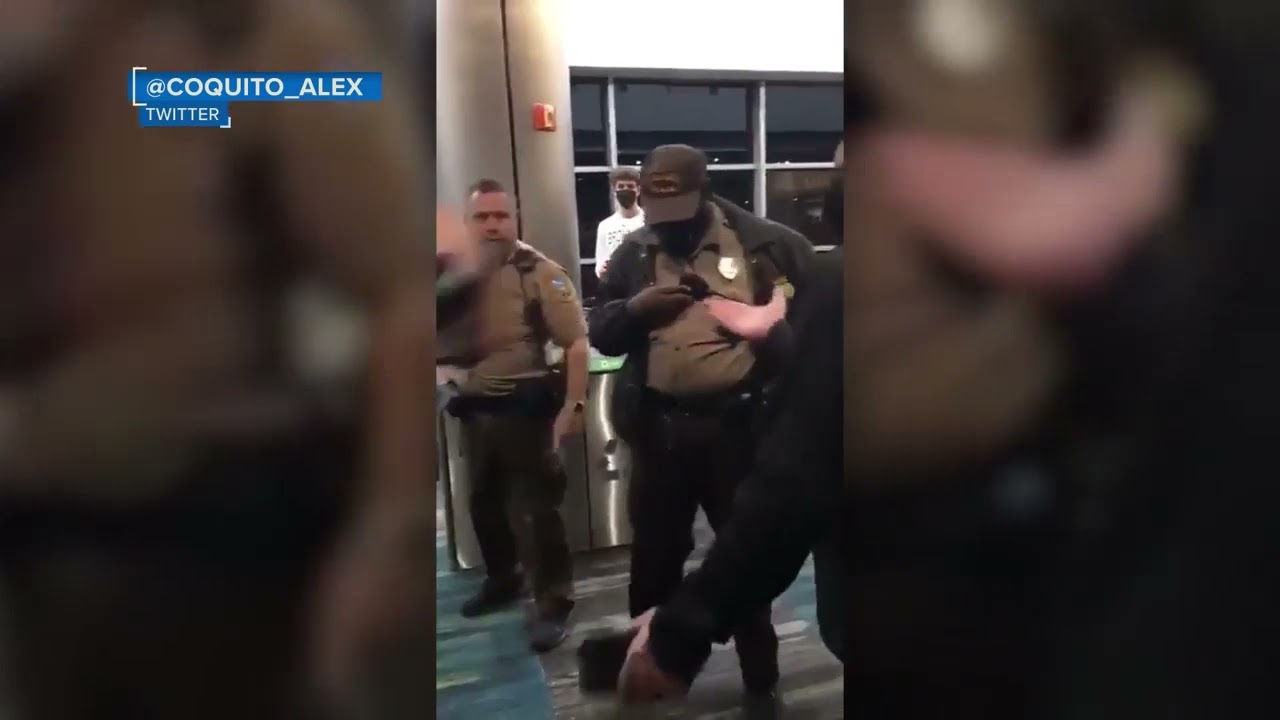 White Cop starts fight with passengers  in Airport.
